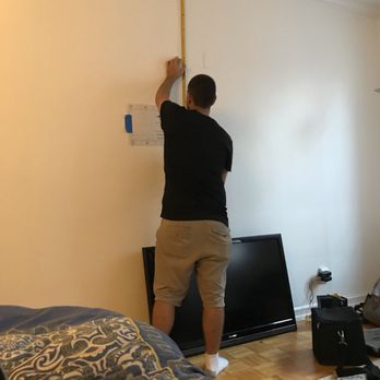 Yorkville Handyman - Josh technician hanging a TV - Handyman Near Me - New York, New York Yorkville Handyman - Josh technician hanging a TV - Handyman Near Me - New York, New York