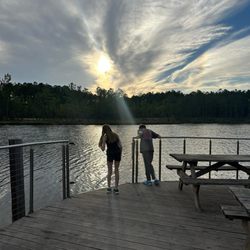 Magnolia Branch Wildlife Reserve - The kids watching the sun set on the lake pier.