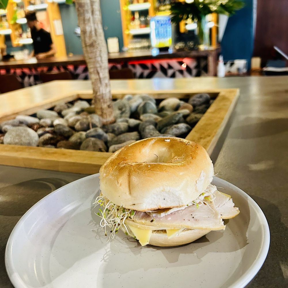Dona Posada - Turkey sandwich on a plain bagel - Juice Bars & Smoothies Near Me - Miami, Florida Dona Posada - Turkey sandwich on a plain bagel - Juice Bars & Smoothies Near Me - Miami, Florida