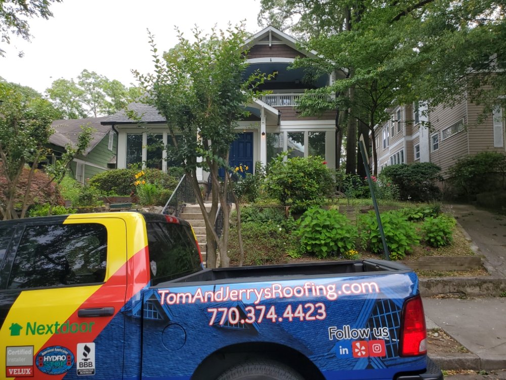 Slide of Tom and Jerry's Roofing