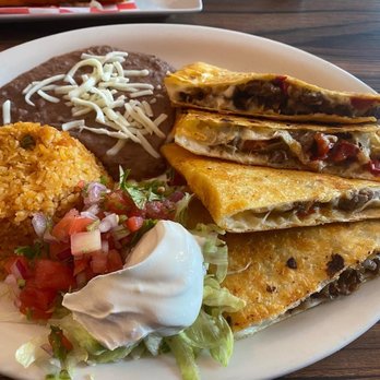 El Paso Restaurant - A plate with four cheese quesadillas, Mexican rice, refried beans topped with cheese, and a side of pico de gallo and sour cream. - Mexican Near Me - Central Falls, Rhode Island
