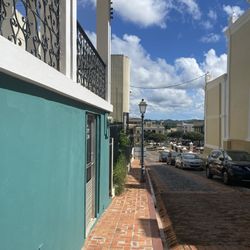 Me Latte Un Pocillo - One of the first cobblestone streets in the old and historic city of San Germán, Puerto Rico.