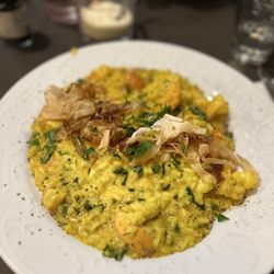 Bacio - Risotto with shrimp, calamari, and muscles topped with pancetta.