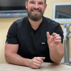 Orange County Orthodontics - Dr. C displaying Invisalign aligner