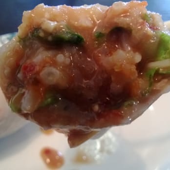 Pho Ca Dao & Grill - Spring roll dunked in peanut sauce. - Vietnamese Near Me - Santee, California Pho Ca Dao & Grill - Spring roll dunked in peanut sauce. - Vietnamese Near Me - Santee, California
