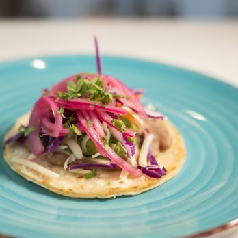 Taco Uprising - El Vegano - refried beans, guac, vegan cheese, slaw, cilantro, pickled red onions on a corn tortilla - Cocktail Bars Near Me - Denver, Colorado