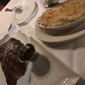Larkin's - Bone-in NY strip with scalloped potatoes. As good as our steakhouses in Charleston. - Steakhouses Near Me - Greenville, South Carolina Larkin's - Bone-in NY strip with scalloped potatoes. As good as our steakhouses in Charleston. - Steakhouses Near Me - Greenville, South Carolina