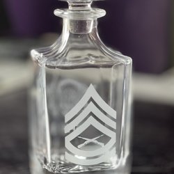 Custom insignia laser etching on a glass whiskey decanters for US Marine Corps