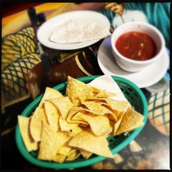 Cinco De Mayo - Complimentary tortilla chips with awesome salsa, and tortilla w/ cheese in the back