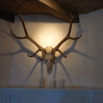 Santacafé - Beautiful lighting on the skulls and antlers in each of the small dining rooms. - Cafes Near Me - Santa Fe, New Mexico Santacafé - Beautiful lighting on the skulls and antlers in each of the small dining rooms. - Cafes Near Me - Santa Fe, New Mexico