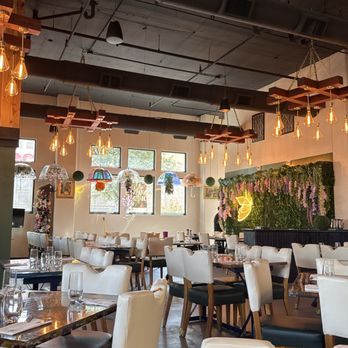Lunami - They just put up some floral decorations on the walls and hanging from the ceiling! - Latin American Near Me - Dallas, Texas