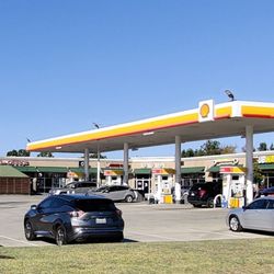 Shell - Fairly spacious parking lot and gas station. Entrances on Trinity Blvd and on Main St.
