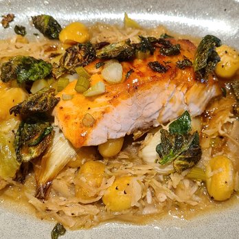 Tavern in the Square - Honey Citrus Salmon - Tasty, cider braised cabbage, pickled fennel, gnocchi not pan crisped. - New American Near Me - Wrentham, Massachusetts Tavern in the Square - Honey Citrus Salmon - Tasty, cider braised cabbage, pickled fennel, gnocchi not pan crisped. - New American Near Me - Wrentham, Massachusetts