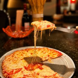 Guido's Italian Restaurant - Cheese pizza with fresh tomatoes