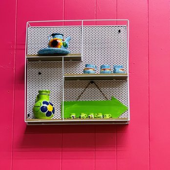 Homemade Taqueria Bellerose - a shelf on a pink wall - Mexican Near Me - Bellerose, New York Homemade Taqueria Bellerose - a shelf on a pink wall - Mexican Near Me - Bellerose, New York