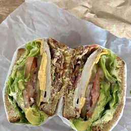 Super yummy turkey club (BLT) on wheat bread. Ingredients are plentiful! Super yummy turkey club (BLT) on wheat bread. Ingredients are plentiful!