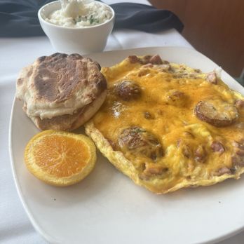 Messina's Runway Cafe - My guy had.. an Open face meat lovers omelette. He enjoyed it. - Breakfast & Brunch Near Me - New Orleans, Louisiana