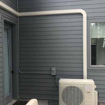 Central Heating & Cooling - Exterior HVAC mini-split unit. Note the quality installation - when painted, the conduits will disappear. - Heating & Air Conditioning/HVAC Near Me - Kalispell, Montana Central Heating & Cooling - Exterior HVAC mini-split unit. Note the quality installation - when painted, the conduits will disappear. - Heating & Air Conditioning/HVAC Near Me - Kalispell, Montana