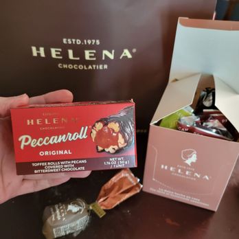 Helena Chocolatier Store - a person holding a box of chocolates - Chocolatiers & Shops Near Me - Miami, Florida