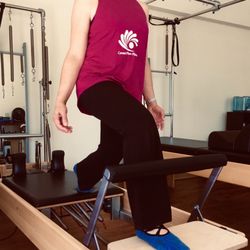 Carmel Flow Pilates Studio - Having fun with a dedicated client sporting our activewear.