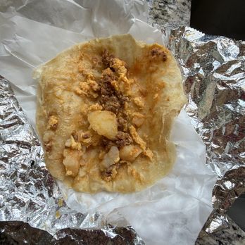 Miguel's Jr - This is supposed to be a bacon breakfast taco? Not sure what the ground meat is and where is the egg - Mexican Near Me - Menifee, California