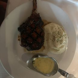 Pork chop and mash potatoes with a sauce Pork chop and mash potatoes with a sauce