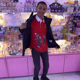 My son taking a picture inside the store My son taking a picture inside the store