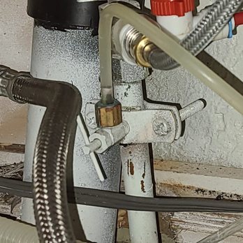 Alpha And Omega Plumbing - Faulty saddle valve that was replaced. It's a tiny 1/4" line that can cause a lot of damage if corroded and leaking. - Plumbing Near Me - Riverside, California Alpha And Omega Plumbing - Faulty saddle valve that was replaced. It's a tiny 1/4" line that can cause a lot of damage if corroded and leaking. - Plumbing Near Me - Riverside, California
