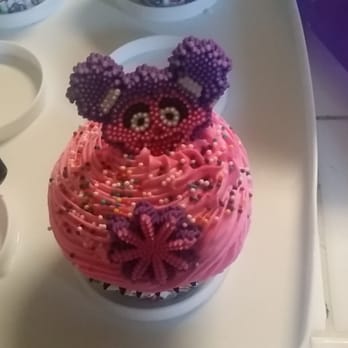 Cupcake Party - a cupcake decorated with pink frosting - Desserts Near Me
