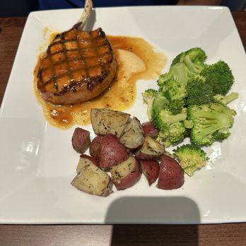 J.B. Steele's - Pork chop, roasted red potatoes and broccoli - American Near Me - Lexington, Kentucky J.B. Steele's - Pork chop, roasted red potatoes and broccoli - American Near Me - Lexington, Kentucky
