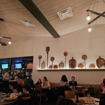 Piattello Italian Kitchen - Love the pizza paddles on the wall - Pizza Near Me - Fort Worth, Texas