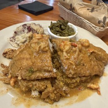 Grapevine Cafe and Gallery - Crawfish corn bread covered with fried fish and crawfish etouffee. - Cajun/Creole Near Me - Donaldsonville, Louisiana