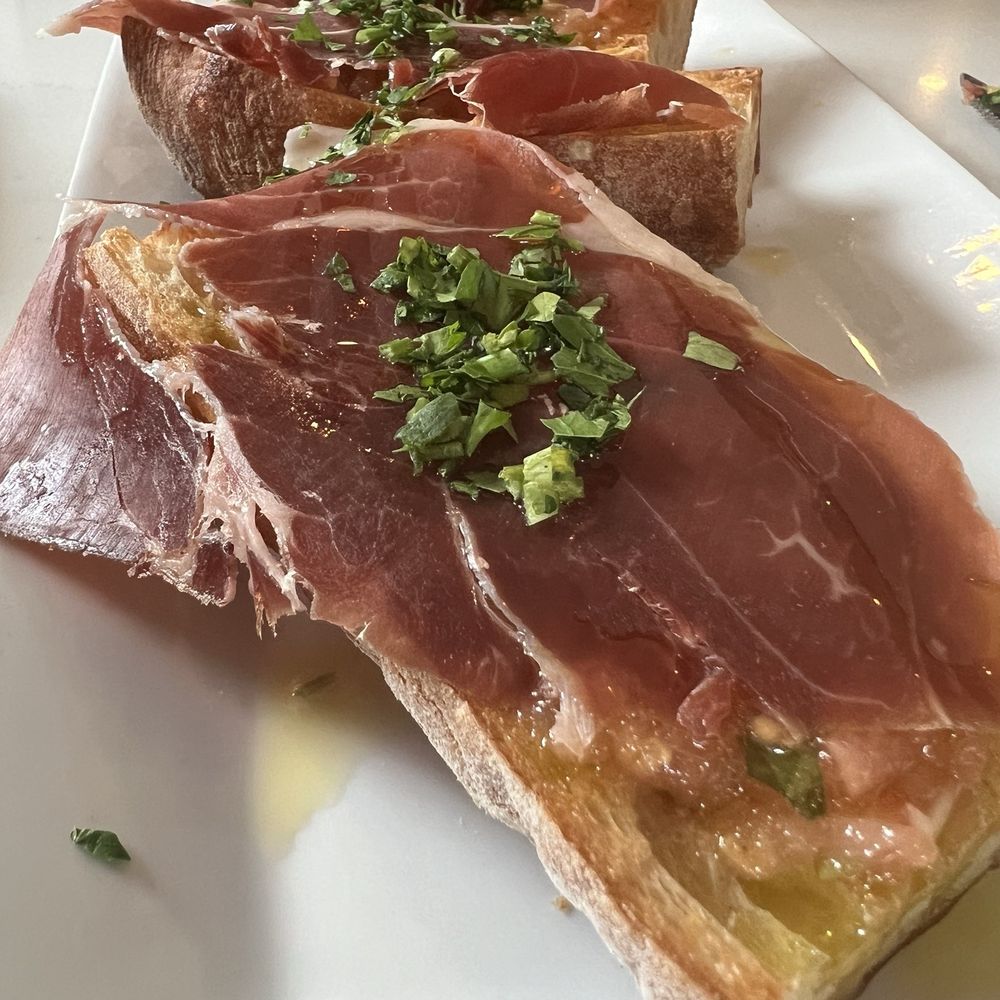PAN con TOMATE ~  Fresh tomato spread, olive oil, garlic, Iberico ham over country toast - an exceptional plate.