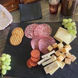 Elayna's - Charcuterie board with fresh meats, cheese, grapes and crackers. Such a great mix! *Moscow mule in the background