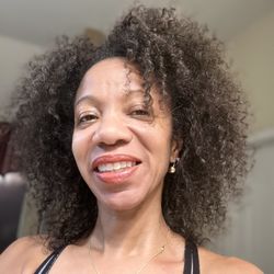 Texas Hair Restoration And Wellness Center - My hair worn natural 8 months after treatments. Fuller, almost no shedding and much stronger her with length.