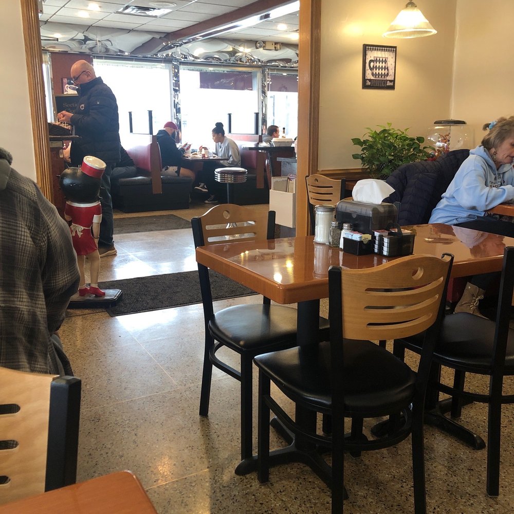 a man sitting at a table a man sitting at a table