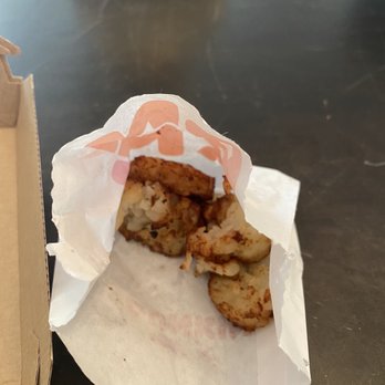 Dunkin' -  a half eaten doughnut in a paper bag - Coffee & Tea Near Me - Pingree Grove, Illinois