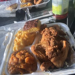 Four piece fried wing dinner with Mac and cheese and Yams Four piece fried wing dinner with Mac and cheese and Yams