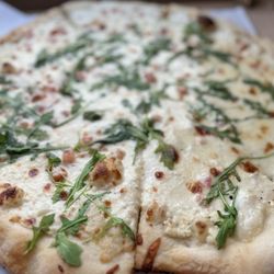 Hilo Pizza Company - White pizza w added arugula and tomatoes (very small, barely there pieces of tomato - not worth the $2 extra).