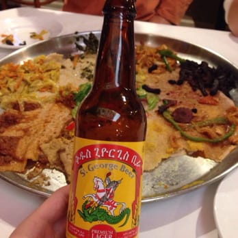 Demera - St. George's beer and family style dinner in the background - Ethiopian Near Me - Chicago, Illinois
