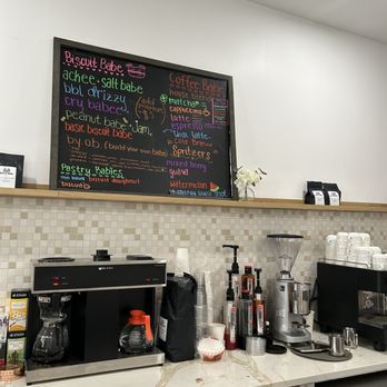 The Biscuit Babe - Behind the cash register.  The menu hand written on the chalkboard. - Coffee & Tea Near Me - Hoboken, New Jersey