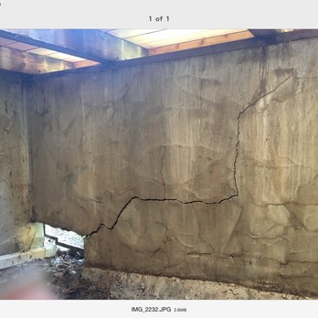 Mike's masonry - Cracked retaining wall, under our front porch deck. He removed the cracked wall. - Masonry/Concrete Near Me
