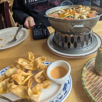 Merit Vegan Restaurant - Wonton poppers in the foreground and my coworker's tom yum soup order in the background. It comes with fire! - Vegetarian Near Me - Sunnyvale, California