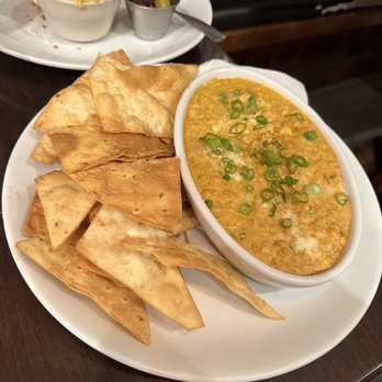 Chef's Bistro - Street Corn Dip Roasted corn, garlic, lime, cotija, cream cheese, cilantro, house tortilla chips - American Near Me - North Conway, New Hampshire Chef's Bistro - Street Corn Dip Roasted corn, garlic, lime, cotija, cream cheese, cilantro, house tortilla chips - American Near Me - North Conway, New Hampshire