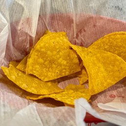 a close up of a basket of chips