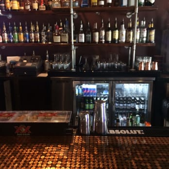 Aqua Vitae Lounge - a bar with bottles of alcohol - Bars Near Me - Savannah, Georgia Aqua Vitae Lounge - a bar with bottles of alcohol - Bars Near Me - Savannah, Georgia
