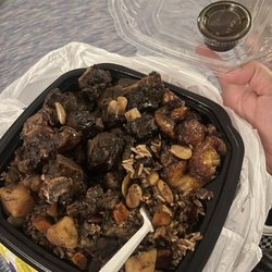 Coconut Breeze Cuisine - Medium Oxtail with sides of rice and beans, plantains, and extra gravy.