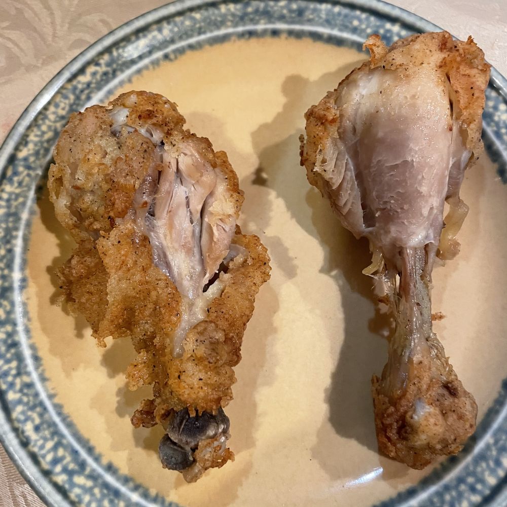 My 8pc order came w/these lovely 2pcs.  Looks like someone took a bite and the other had no skin.  Someone at KFC was a bit hungry.