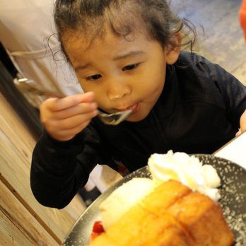 Spot Dessert Bar - Little one enjoying her Golden Toast - Desserts Near Me - Flushing, New York