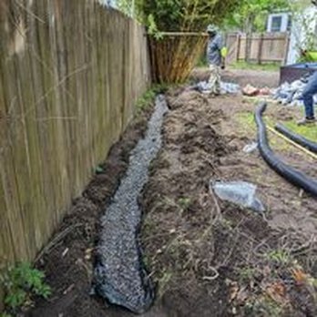 Nexlevel Ground Pros - a man working on a trench - Landscape Architects or Designers Near Me